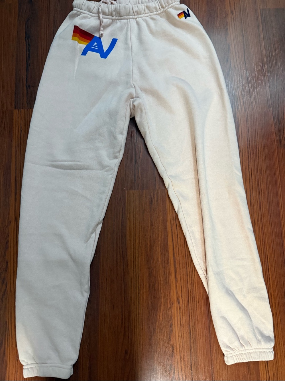 Aviator Nation Cream Track Pants with Blue & Rainbow Logo